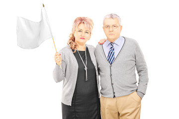 Sticker - Middle aged couple waving a white flag