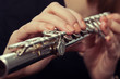 Hands girl playing a flute