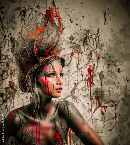 Fototapeta na wymiar Young woman muse with creative body art and hairdo