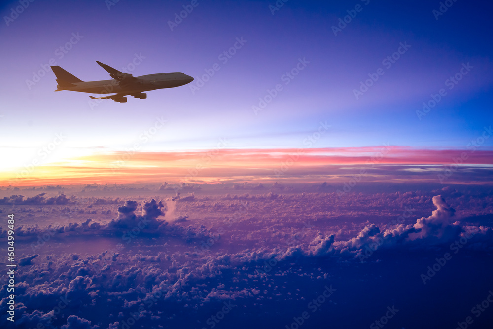 Airplane in the sky at sunrise - obrazy, fototapety, plakaty 