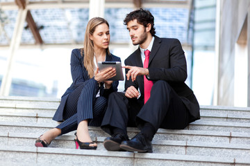 Wall Mural - Business people using a tablet