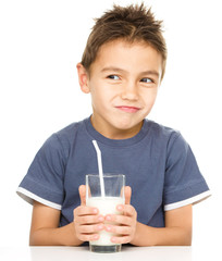 Wall Mural - Cute boy with a glass of milk