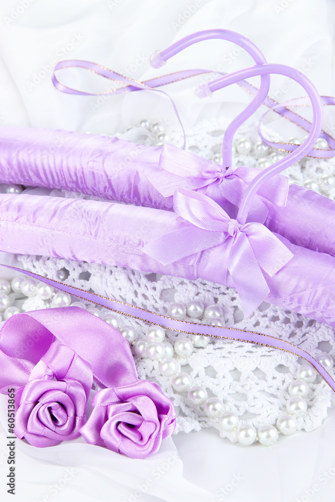 Beautiful hanger on fabric background