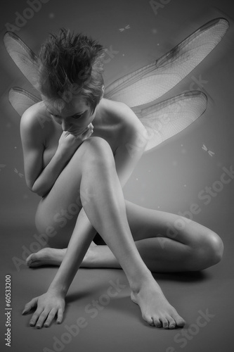 Fototapeta dla dzieci Portrait of girl with wings. Studio fashion photo.