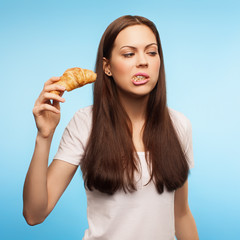 beautiful girl breakfast . portrait in the studio. blue backgrou