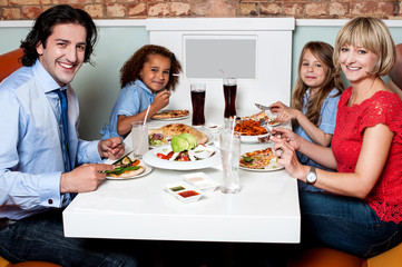 Family eating together in a restaurant