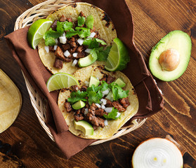 overhead view of two traditional tacos in a basket.