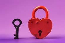 Heart-shaped Padlock With Key On Purple Background