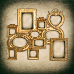 Wall Mural - antique golden frames over grungy wall background