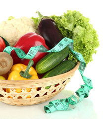 Fototapete - Fresh vegetables in wicker basket isolated on white