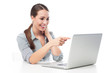 © pikselstock - Woman pointing at laptop
