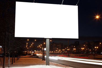 Empty roadside billboards at evening in city