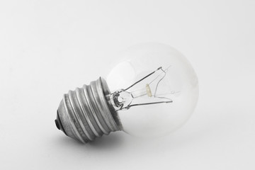 Light bulb in natural light on white background