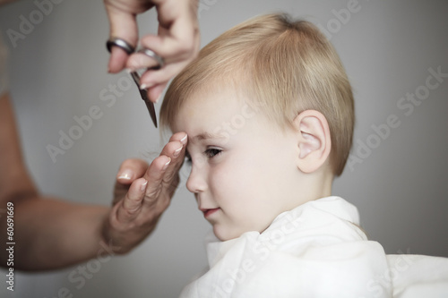 Fotografie, Obraz Little girl having her fist time at hairdresser