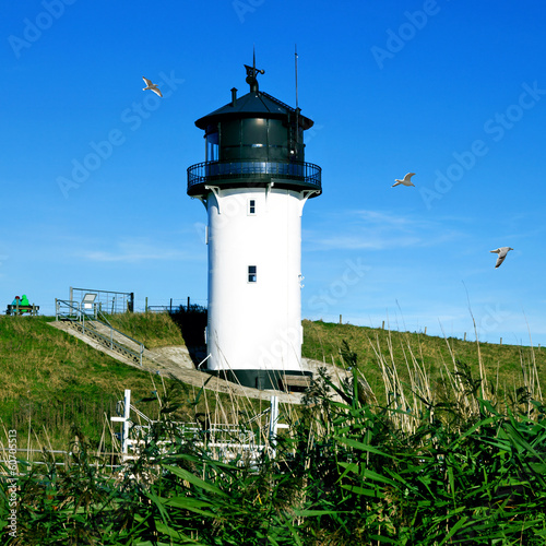 Board z aluminiowym obramowaniem Latarnia morska w Cuxhaven