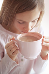 Canvas Print - Child drinking cocoa