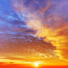 Wall Mural - Sky with dramatic cloudy sunset and sun