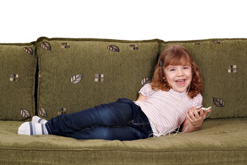 Wall Mural - happy little girl listening music on phone