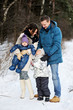 © Alinute - Happy family enjoying a walk in winter park