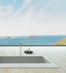 Fantastic floor bathtub against window with seascape view