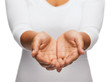 © Syda Productions - womans cupped hands showing something