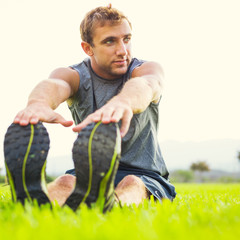 Young man stretching before exercise