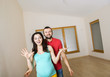 © Halfpoint - Pregnant mother and happy father in new house