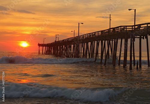 Fotografie, Obraz Sunrise by a fishing pier in North Carolina