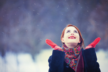 Beautiful redhead women with in winter park.