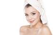 © vladimirfloyd - smiling beautiful girl with a towel on her head posing on white