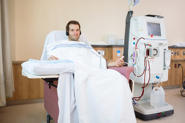 Wall Mural - Patient Listening To Music While Receiving Renal Dialysis