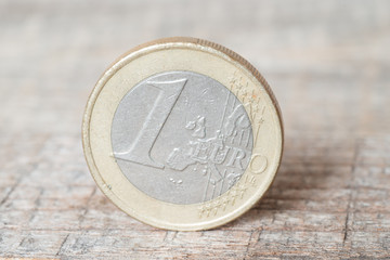 Euro coins on wooden table