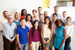 © Monkey Business - Portrait Of Multi-Cultural Office Staff Standing In Lobby