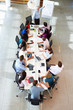 © Monkey Business - Businessman Addressing Meeting Around Boardroom Table