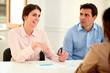 © pablocalvog - Businesswoman explaining to colleagues an idea