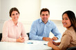 © pablocalvog - Charming adult colleagues smiling at you