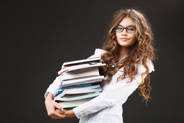 young cute girl with stack of books