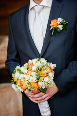 Canvas Print - groom with flowers