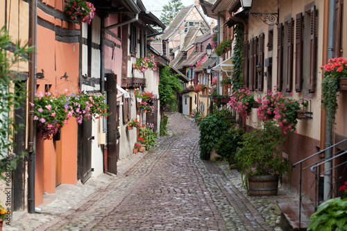 Naklejka - mata magnetyczna na lodówkę Street with half-timbered medieval houses in Eguisheim