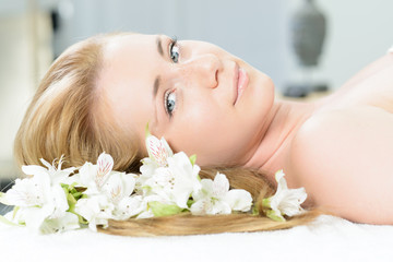 young woman lying relaxed for a body treatment.