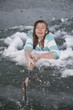 girl in ice hold swinging axe
