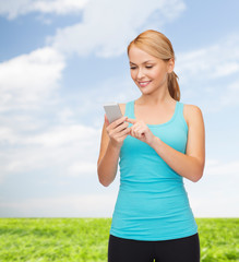 Poster - sporty woman with smartphone