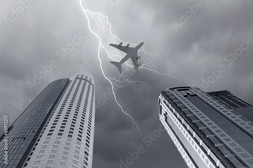 Fototapeta na wymiar Airplane above city