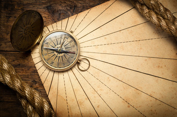 Wall Mural - Old compass and rope on vintage paper.