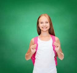 Wall Mural - smiling teenage girl in blank white tank top