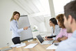 © goodluz - Manager doing business presentation on whiteboard