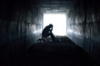 Leinwandbild Motiv depressed man sitting in the tunnel