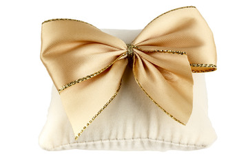 Soft pillow decorated with a bow