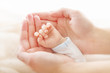 Newborn baby hand in mother hands. Help asistance concept