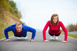 © Jacek Chabraszewski - Woman and man doing push-ups